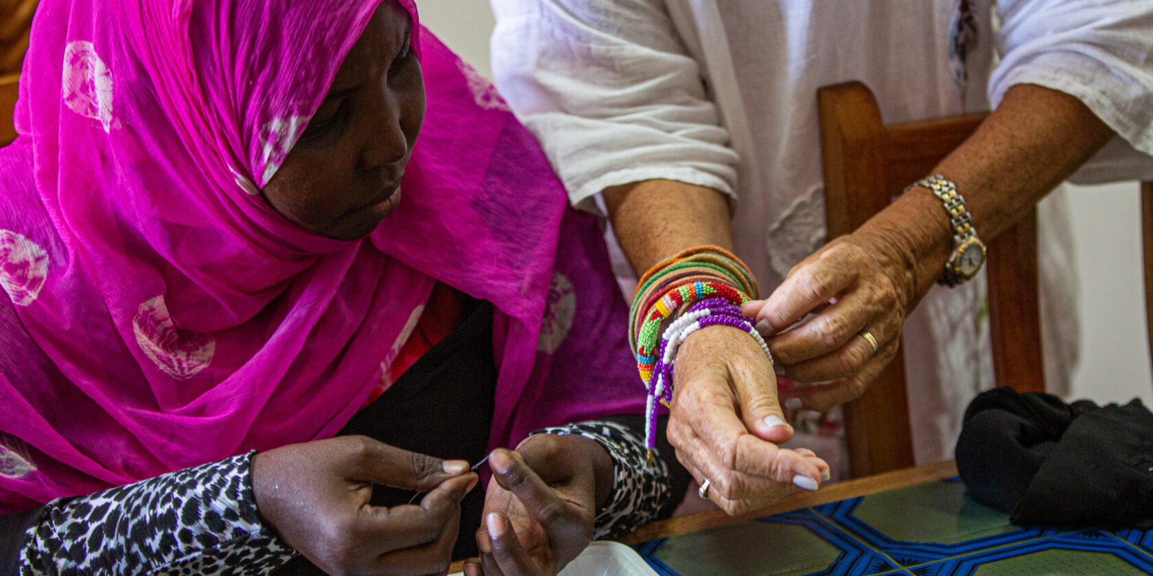 Bracelets being inspected by Ruth and a patient